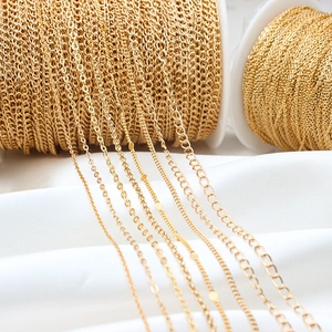 Detailed macro view of various gold plated flat O-link jewelry chains for DIY crafting