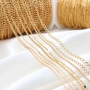 Close-up of various gold-plated flat O-chains and DIY jewelry link accessories