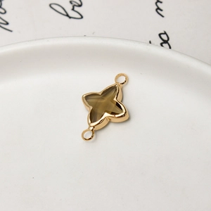 Detailed macro of gold-plated star pendant with smoky brown resin for DIY jewelry