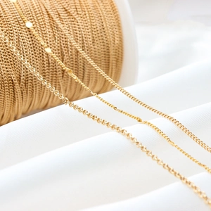 Macro detail of gold plated thin copper link chains for DIY jewelry making accessories