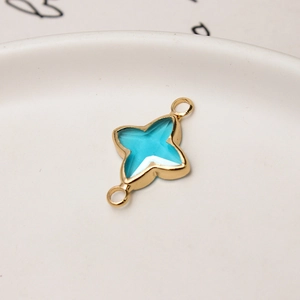 Detail of star-shaped lake blue crystal pendant with gold-plated double rings for DIY jewelry