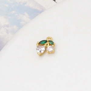 Detail of cherry pendant with green leaf stones and white heart-shaped zircon charms