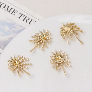 Apprêts bijoux DIY forme feu d'artifice dorés avec pavage zircons sur plateau céramique