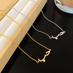 Minimalist gold and silver beaded necklaces with Arabic Love calligraphy pendants