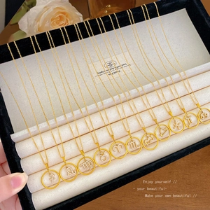 Zodiac pendant necklace set in gold-plated copper featuring 12 crystal-encrusted constellations