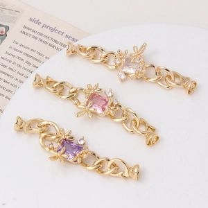 Macro shot of gold floral pearl clasps with rectangular zircon stones for DIY jewelry