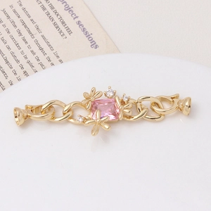 Macro shot of gold floral connector with pink zircon and pearls for DIY jewelry making