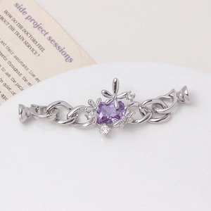 Macro detail of silver floral clasp with purple stone for DIY jewelry making