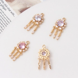 Golden dreamcatcher pendant with zircons and hanging feathers for DIY jewelry making