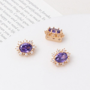 Detail of oval purple stone with gold base and zircon inlay for DIY jewelry making