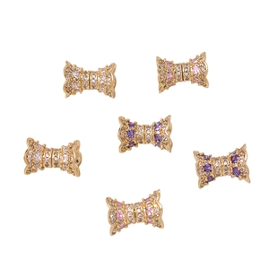 Golden bow-shaped necklace clasps with pink and purple zircons set of six pieces