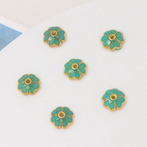 Detailed top view of 8mm teal cloisonné enamel flower bead spacers for jewelry DIY