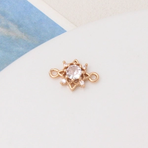 Detail of gold starburst charm with micro-pave cubic zirconia for DIY jewelry making