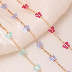 Gold-plated chain necklace with colorful acrylic butterflies in purple, pink and teal