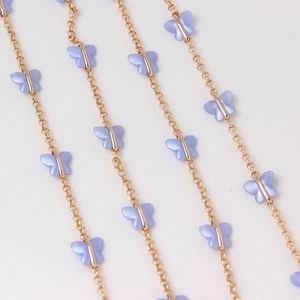 Detail of gold-plated O-link chains with pearlescent purple acrylic butterfly charms