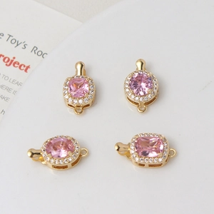 Detail of pink zircon gold-plated connector clasps for DIY jewelry making