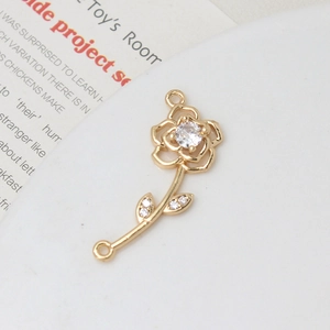 Detailed view of a gold-plated rose jewelry connector with micro-set cubic zirconia for DIY