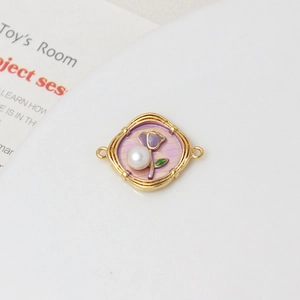 Detail of purple enamel rose flower pendant connector with white pearl and gold frame
