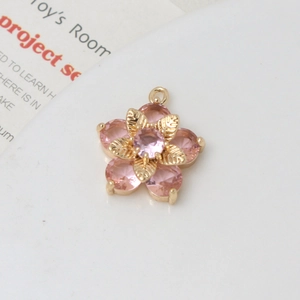 Detail of pink zircon daisy pendant with gold plating for DIY jewelry making