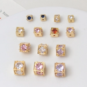 Macro shot of colorful cubic zirconia spacer beads in gold plated copper for DIY jewelry