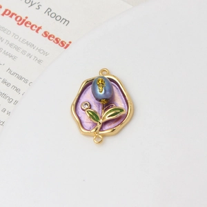 Macro shot of a floral enamel connector with freshwater pearls for DIY jewelry making