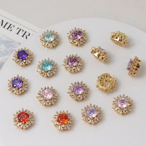 Detailed close-up of 18K gold plated sunflower jewelry charms with colorful cubic zirconia