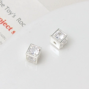Macro detail of cubic zirconium spacer beads with polished silver finish for jewelry making