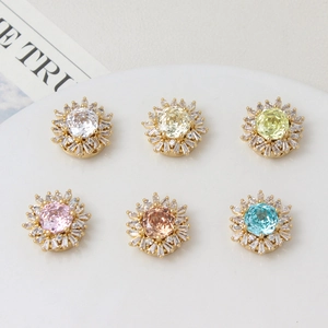 Macro shot of 18k gold plated sunflower spacers with multi-color zircon stones for bracelets