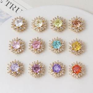 Detailed macro view of 12-piece colorful zircon snowflake flower beads in gold plating