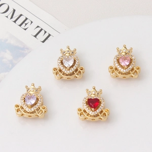 Detailed macro of gold-plated crown heart charms with cubic zirconia for jewelry DIY
