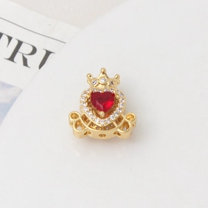 Close-up of gold crown carriage charm with red heart crystal and pave cubic zirconia