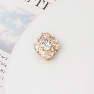 Detail of gold rhombus spacer bead with cubic zirconia for pearl bracelet making