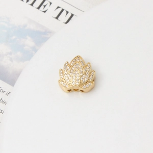 Macro shot of gold-plated lotus bead with cubic zirconia for jewelry making