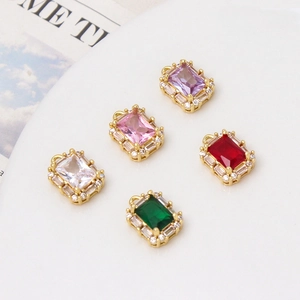 Macro detail of rectangular jewelry pendants in five colors with gold plating and zircon