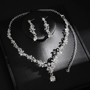 Macro detail of bridal jewelry set with sparkling rhinestones on an elegant vine necklace