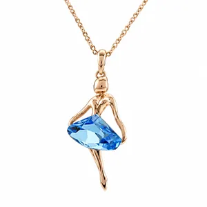 Elegant rose gold ballet dancer pendant necklace with a large blue faceted crystal stone