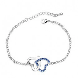 Silver bracelet with interlocking double hearts featuring sparkling blue crystal pavé