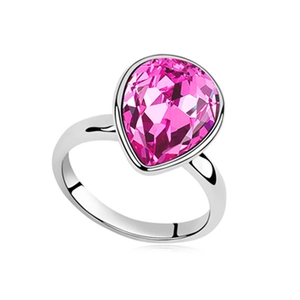 Elegant silver ring featuring a large pear-shaped pink crystal and polished metal band