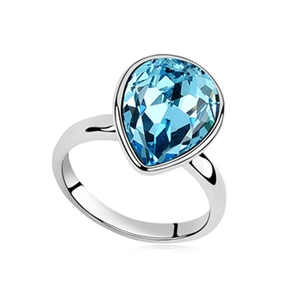 Minimalist silver ring featuring a pear-cut light blue crystal in a sleek bezel setting