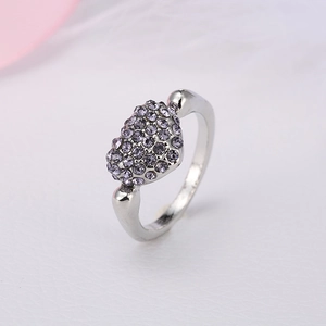 Polished silver heart ring featuring pavé-set purple crystals shown from a side view