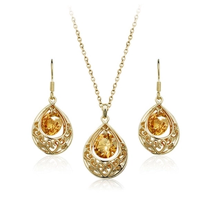 Set gioielli vintage placcato oro con cristalli champagne e intagli a cuore