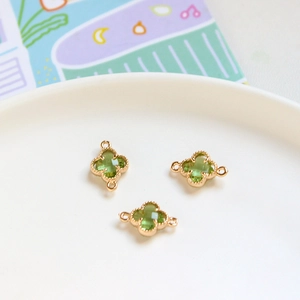 Three green crystal four-leaf clover connectors with gold bead edges for DIY jewelry