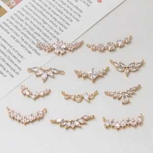 Detailed macro view of gold plated jewelry pendants with micro-pave cubic zirconia stones