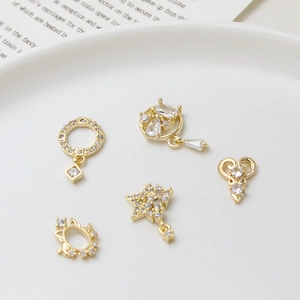 Golden geometric zircon charms in heart and star shapes for DIY jewelry making