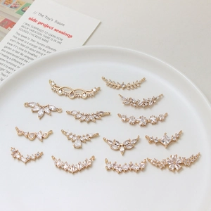 DIY gold-plated zircon leaf and star jewelry connectors for necklace making in a tray