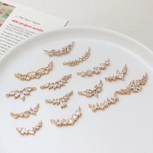 Detailed view of micro-pave zircon gold pendants for DIY jewelry making and craft supplies