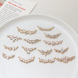 Macro view of 13-piece gold-plated zircon leaf and floral jewelry connectors for DIY making