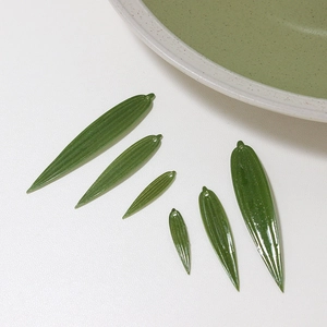 Detail of green bamboo leaf charms for DIY hairpins and traditional Chinese jewelry crafts