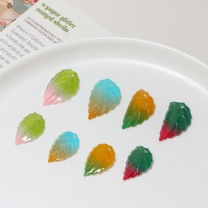 Detailed view of colorful translucent resin leaf pendants with gradient vein textures