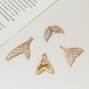 Golden mermaid tail and wing charms with micro-paved zircons for jewelry making